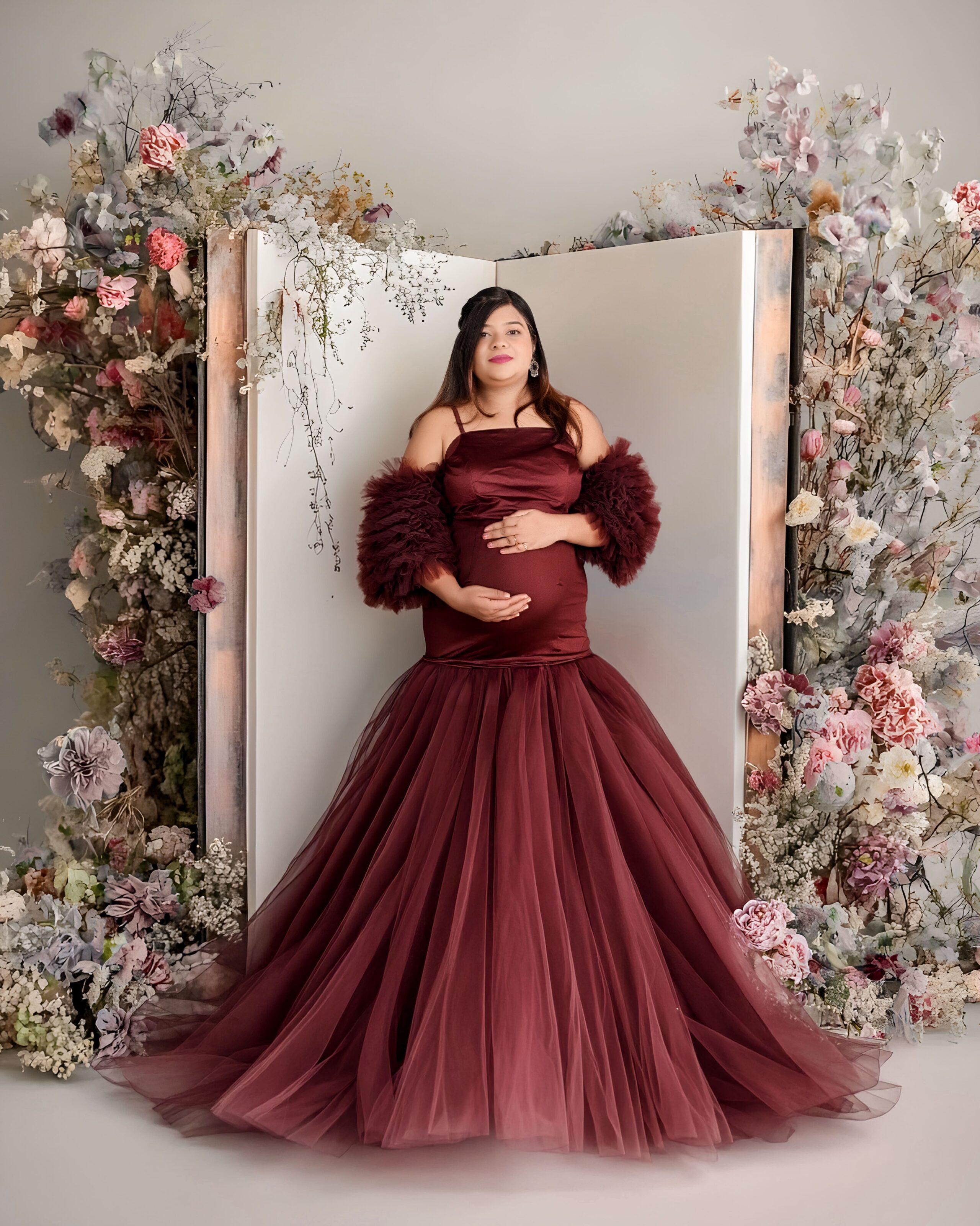 Professional newborn photoshoot in Nagpur at MatBaby Pictora featuring safely posed sleeping baby with soft wraps and studio lighting.