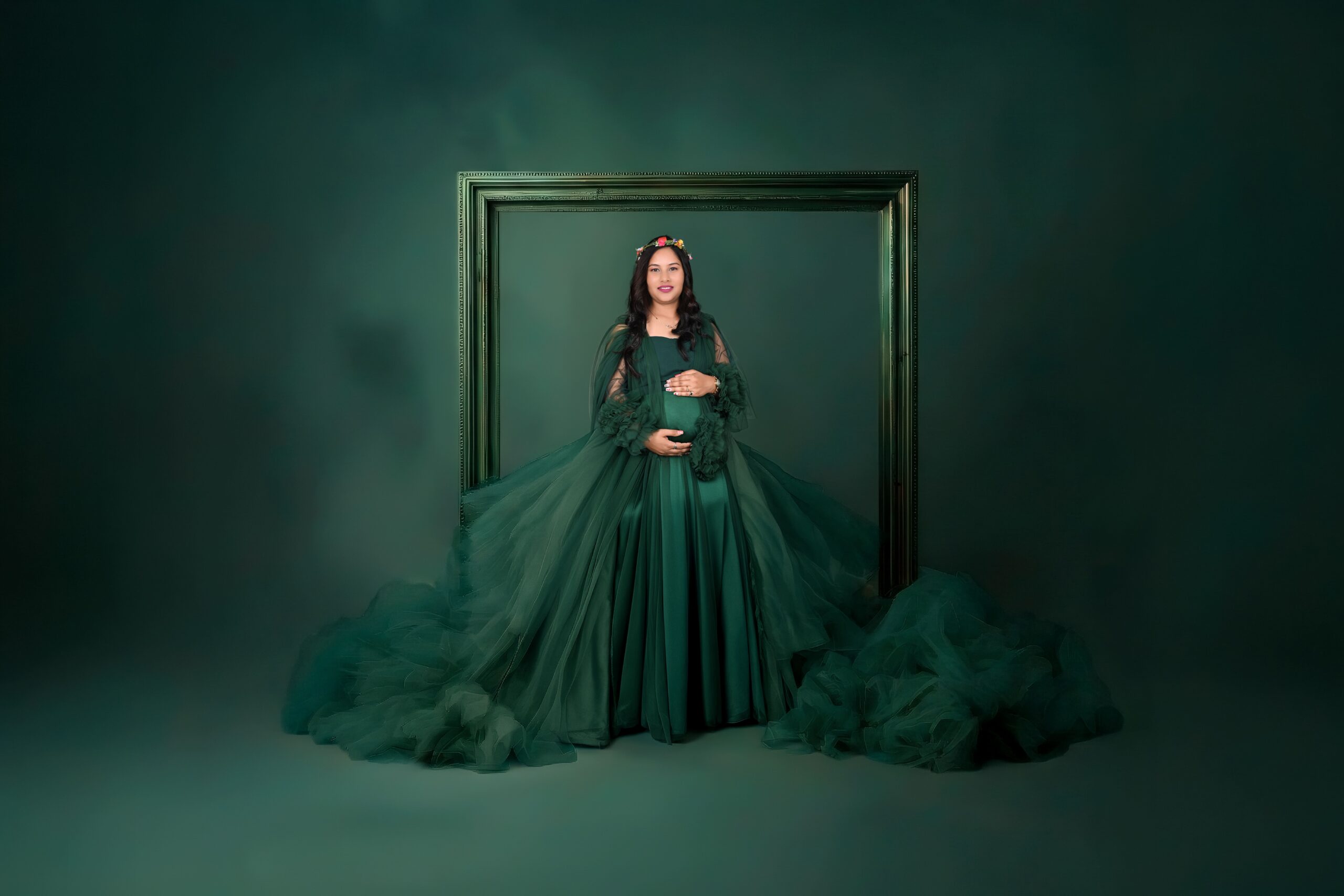 Luxury baby bump photoshoot in Nagpur at MatBaby Pictora featuring glowing pregnant woman in elegant maternity gown with studio setup