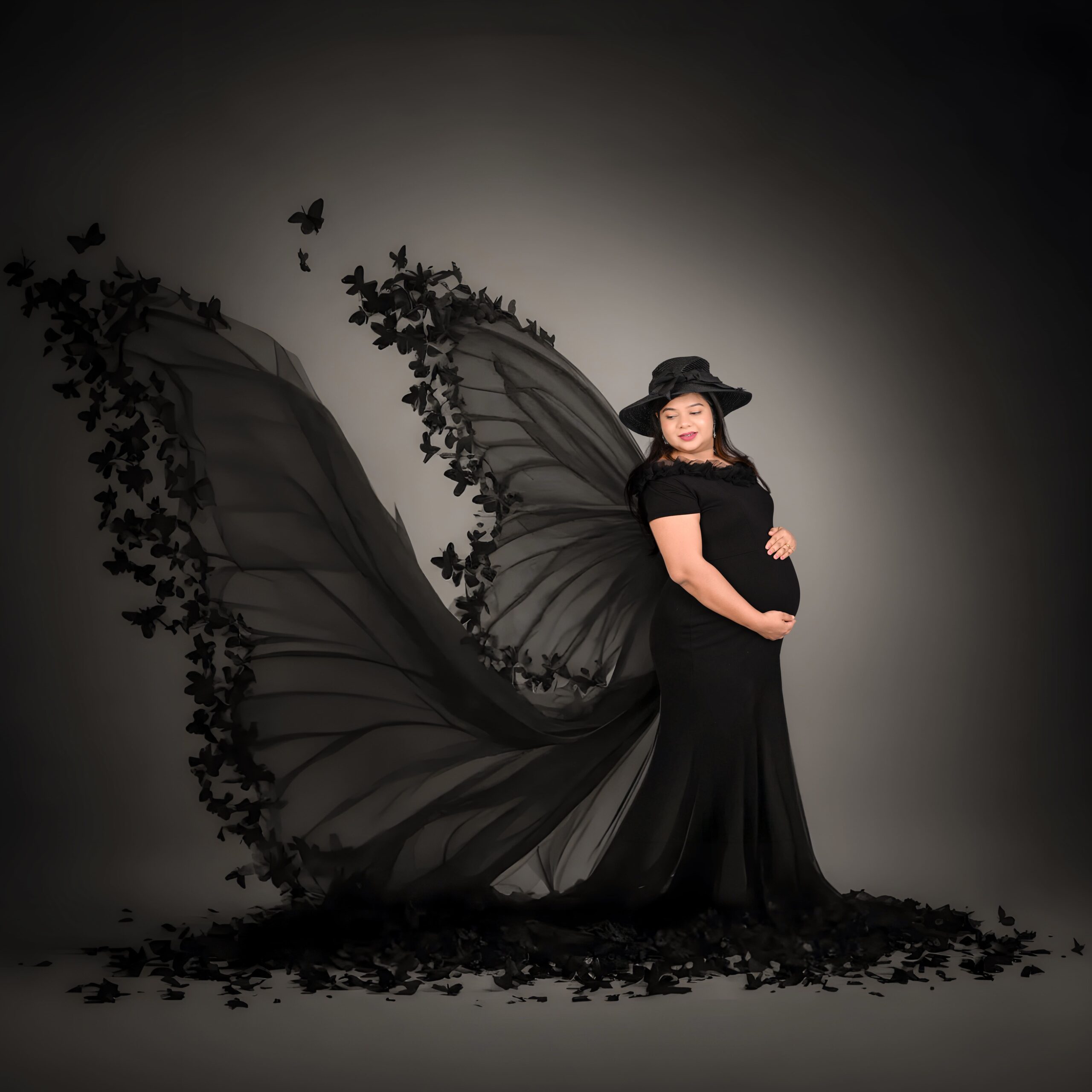 Luxury baby bump photoshoot in Nagpur at MatBaby Pictora featuring glowing pregnant woman in elegant maternity gown with studio setup.