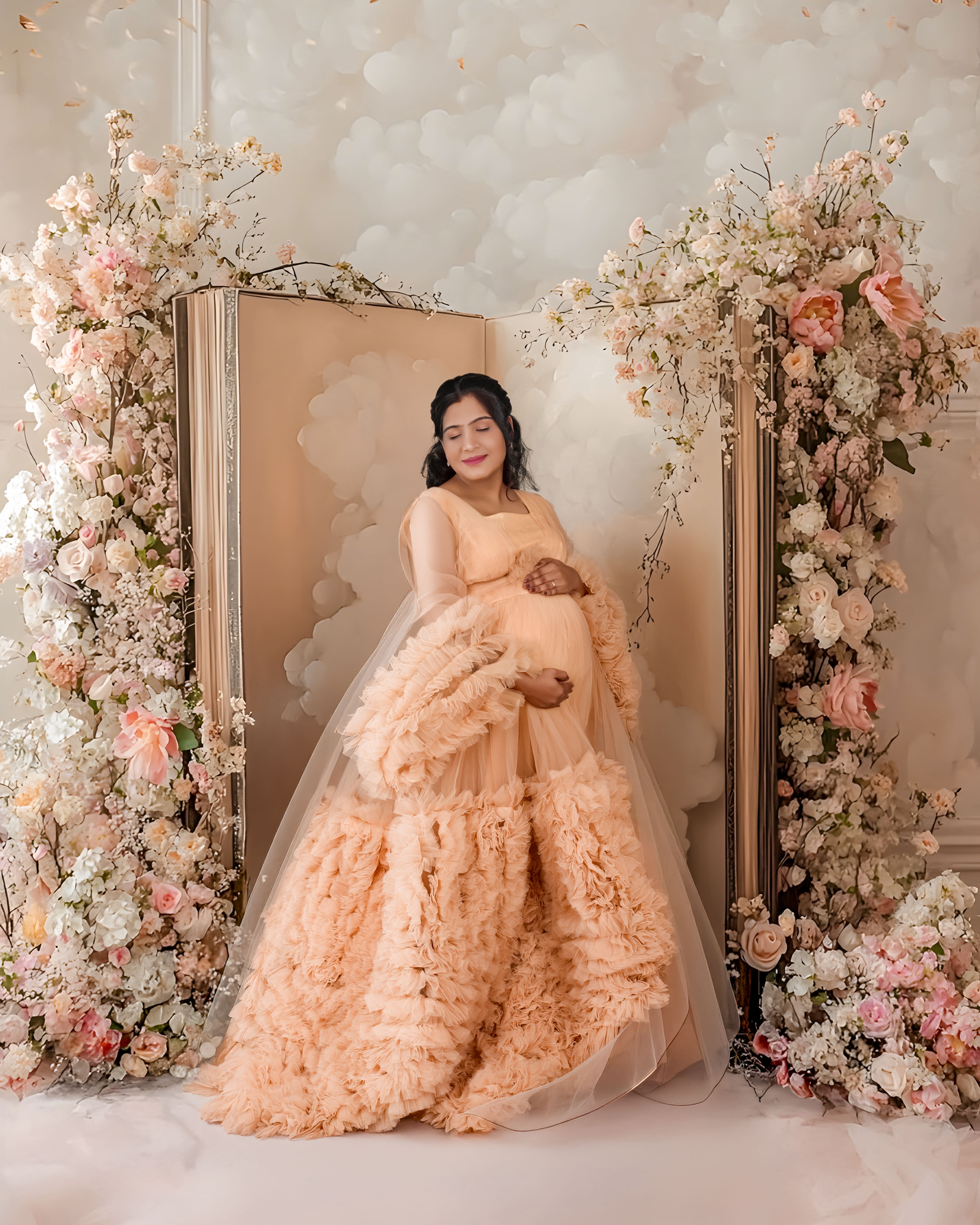 Premium maternity photoshoot at MatBaby Pictora studio in Nagpur featuring elegant baby bump portrait with professional lighting and designer gown.