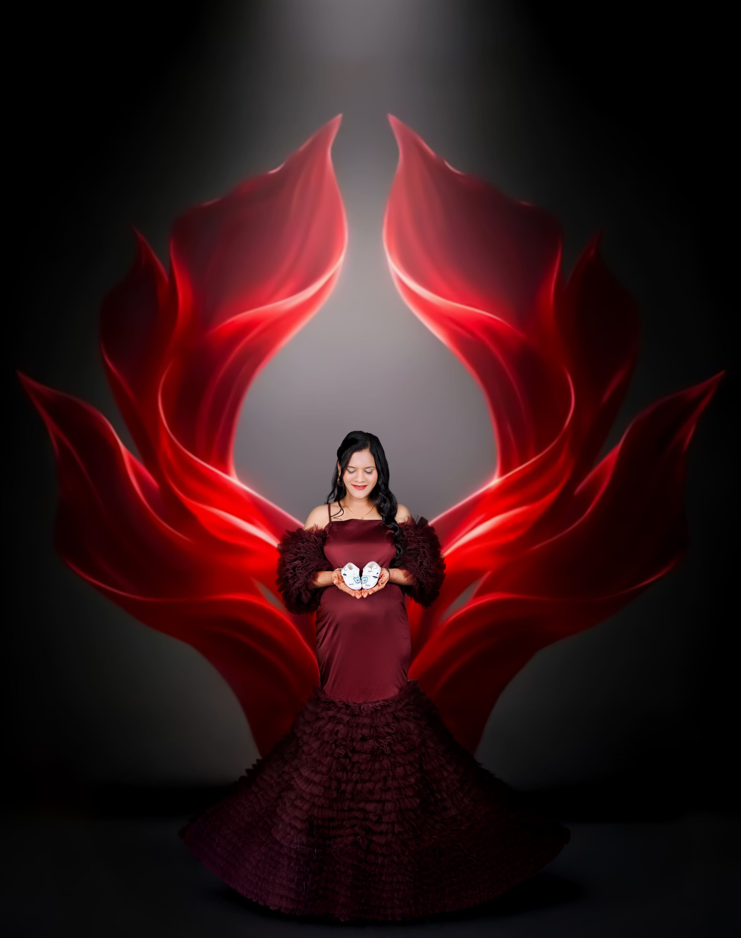 Premium maternity photoshoot at MatBaby Pictora studio in Nagpur featuring elegant baby bump portrait with professional lighting and designer gown.